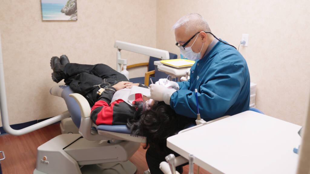 Image of our Dale City, VA dentist servicing a patient